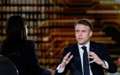 Macron (R) talked up French tech firms in a TV interview