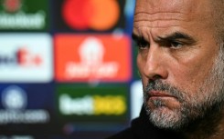 Manchester City manager Pep Guardiola speaks to the press on the eve of the first leg of their Champions League playoff against Real Madrid
