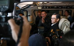 Freed Thai national Pongsak Thaenna leaves in a car after his return to Thailand with four others released after being held hostage in Gaza for more than a year