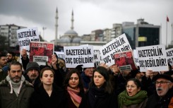 Demonstrators gathered outside the Istanbul courthouse where the BirGun journalists were taking with banners reading: 'Journalism is not a crime' 