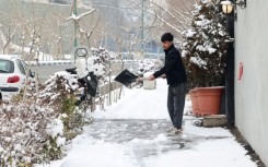 Clearing snow in the capital