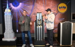 Pete Davidson (R) who voices the titular character in the animated movie 'Dog Man,'  visits The Empire State Building with Dav Pilkey to celebrate the film's premier