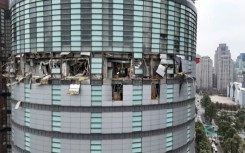 A suspected gas explosion affected several floors of a Taiwan department store, authorities said, and sent debris raining onto the street below
