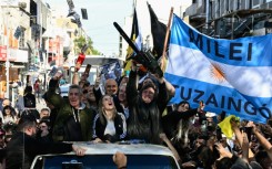 Javier Milei waves a chainsaw during a campaign rally in San Martin, Buenos Aires province, Argentina in September 2023