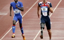 John McFall, right, running in the 2007 Paralympics. He has now been cleared to fly to the ISS