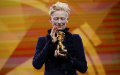 Tilda Swinton lashed out at 'greed-addicted governments' in her acceptance speech for a special award at the Berlin Film Festival