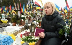 Natalia reads poems to her dead husband in Lviv
