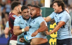 NSW Waratahs' Siosifa Amone (C) celebrates his winning try against the Otago Highlanders 