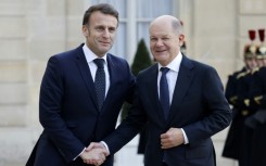 Germany's Chancellor Olaf Scholz (R) said he was 'a little irritated' by suggestions of sending troops