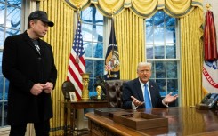 Elon Musk listens as US President Donald Trump speaks in the Oval Office of the White House 