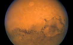 A file photo taken 27 August 2003 by NASA's Hubble Space Telescope shows Mars snapped within minutes of the planet's closest approach to Earth in nearly 60,000 years