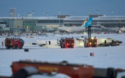 A fireball and thick plumes of black smoke engulfed the plane as it skidded to a halt on its roof