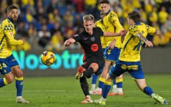 Barcelona playmaker Dani Olmo (C) broke the deadlock with a fine finish against Las Palmas