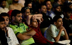 Death of a dream: Cricket fans in Karachi watch a live broadcast of the Champions Trophy match between India and Pakistan on a big screen
