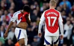 Arsenal's Myles Lewis-Skelly (L) reacts after being sent off against West Ham