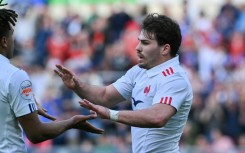 Antoine Dupont (R) scored two tries against Italy