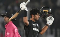 New Zealand’s Rachin Ravindra celebrates after reaching his century against Bangladesh