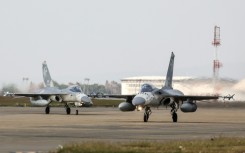 Taiwanese air force Indigenous Defense Fighter aircraft taxi for take-off during a scramble as part of a combat readiness exercise at an air base in Taichung in January