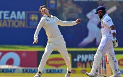 Australia's Matthew Kuhnemann (L) took 16 wickets in the series win over Sri Lanka which resulted in his action being reported