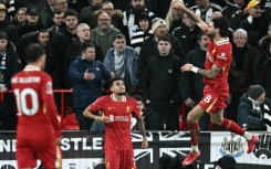 Title push: Liverpool midfielder Dominik Szoboszlai (R) celebrates scoring 