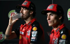 Francesco Bagnaia (L) and  Marc Marquez take part in a press conference in Thailand