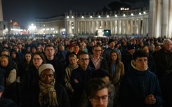 People gather to pray for the health of Pope Francis at St Peter's square 