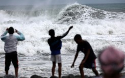 Children playing on the beach in Saint-Denis the day before Cyclone Garance was due to hit La Reunion