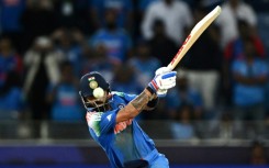 India's Virat Kohli hits the winning boundary against Pakistan in Dubai