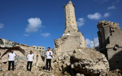 Palestinians pray amid the rubble of Gaza City's historic Omari Mosque.