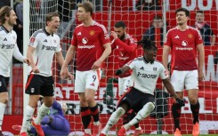 Calvin Bassey (2R) celebrates his FA Cup goal for Fulham against Manchester United at Old Trafford
