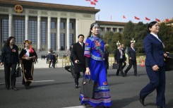 Sporting military uniforms and multi-coloured traditional garb, delegates from the four corners of China descended on the capital Tuesday 