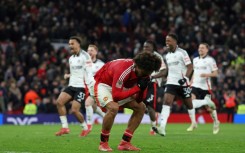 Manchester United's Joshua Zirkzee reacts after missing his penalty against Fulham