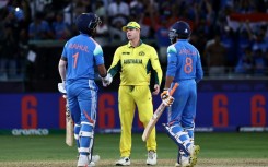 Australia's captain Steve Smith (C) shakes hands with India's KL Rahul