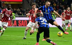 Inter Milan's Dutch defender Stefan de Vrij controls the ball to score his team's first goal during the Italian Serie A football match between AC Milan and Inter at San Siro stadium in Milan last month