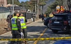 South Korean soldiers stand near a bomb accident site outside a military live-fire training range in Pocheon