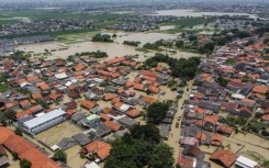 An aerial picture shows a flooded residential area after some rivers overflowed following heavy rain in Bekasi, a suburb of Jakarta, on March 5, 2025