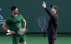 Novak Djokovic and coach Andy Murray work on the Serbian star's serve during practice prior at the Indian Wells ATP Masters
