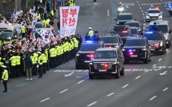 Yoon drove to the presidential residence after his release, and greeted the hundreds of cheering supporters outside