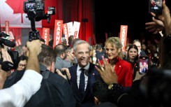 Canada's Liberal Leader and Prime Minister-elect Mark Carney greets supporters in Ottawa on March 9, 2025