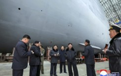 North Korean leader Kim Jong Un (3rd R) visited shipyards focused on building warships, the Korean Central News Agency reported