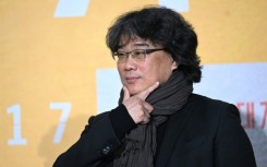 South Korean director Bong Joon-ho poses  during a press conference in Seoul to promote his new film 'Mickey 17,' a dark comedy 