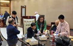 This handout photo taken and released by Rodrigo Duterte's PDP Laban party shows the former Philippine president (C) inside the Villamor Air Base in Manila