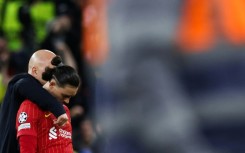 Liverpool manager Arne Slot comforts Darwin Nunez