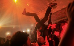 At a smoke-filled warehouse in Jakarta hundreds of Indonesians party to the sounds of 1990s Britain