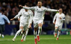 Kylian Mbappe celebrates after Real Madrid beat Atletico Madrid in the Champions League on Wednesday