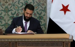 Syrian leader Ahmed al-Sharaa signs a new constitutional declaration, which will regulate the country's transitional period