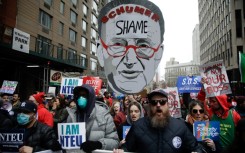 Demonstrators take part in a "March to Stop the Cuts" protest in New York 