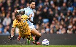 Manchester City forward Omar Marmoush (R) scored against Brighton