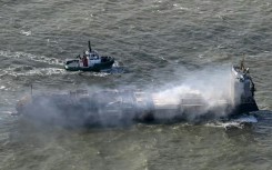 A tugboat accompanies the stricken Solong cargo ship following a devastating crash in the North Sea off the Yorkshire coast