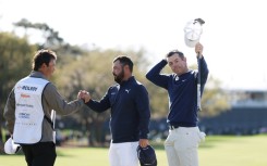 Rory McIlroy celebrates after clinching a playoff victory at The Players Championship in Florida on Monday